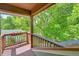 Covered deck with wood railing provides a relaxing outdoor space at 3966 Bosque Ct, Boulder, CO 80301