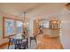 Well lit dining area with modern lighting, and natural wood accents and an open floor plan at 3966 Bosque Ct, Boulder, CO 80301