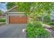 Two car garage featuring paneled wood doors and ample parking at 3966 Bosque Ct, Boulder, CO 80301