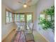 Bright home office space with a glass desk and backyard view at 3966 Bosque Ct, Boulder, CO 80301