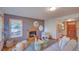 Comfortable living room with a fireplace, wood floors, and windows that let in natural light at 3966 Bosque Ct, Boulder, CO 80301
