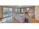 Inviting living room with a fireplace, hardwood floors, large windows, and sliding glass doors to the deck at 3966 Bosque Ct, Boulder, CO 80301