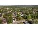 Expansive aerial view of a neighborhood with lush greenery and tree-lined streets at 6470 Field St, Arvada, CO 80004