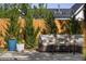 Cozy outdoor seating area with comfortable couch, plants, and privacy from the surrounding fence at 6470 Field St, Arvada, CO 80004