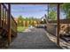 Inviting backyard featuring a patio with hot tub and outdoor seating surrounded by lush greenery and a fence at 6470 Field St, Arvada, CO 80004