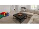 Finished basement with sectional couch, play area, and home office at 6470 Field St, Arvada, CO 80004