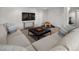 Finished basement with a large sectional couch and play area at 6470 Field St, Arvada, CO 80004