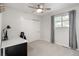 Bright bedroom featuring neutral tones, carpeted floors and a ceiling fan at 6470 Field St, Arvada, CO 80004