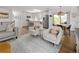 Open concept kitchen, dining and living space with neutral colors and stylish decor at 6470 Field St, Arvada, CO 80004