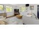 Bright and airy living room showcasing a large window, wood floors, and neutral colors at 6470 Field St, Arvada, CO 80004