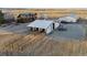 Wide aerial view of multiple outbuildings, structures and the surrounding land at 9703 Phillips Rd, Lafayette, CO 80026