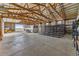 Spacious barn features high ceilings, open layout, concrete floors, and ample storage space, ideal for various uses at 9703 Phillips Rd, Lafayette, CO 80026
