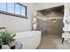 Bathroom features a freestanding tub, walk-in shower, and heated towel rack at 9703 Phillips Rd, Lafayette, CO 80026