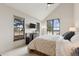Bedroom with vaulted ceilings, neutral carpet, and scenic views from dual windows at 9703 Phillips Rd, Lafayette, CO 80026
