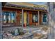 Inviting front porch with stone water feature, complemented by unique architectural details and a cozy ambiance at 9703 Phillips Rd, Lafayette, CO 80026
