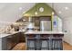 Kitchen with stainless steel appliances, breakfast bar, and modern pendant lighting at 9703 Phillips Rd, Lafayette, CO 80026