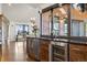 Well-appointed wet bar area with wine storage and prep sink, perfect for entertaining with an open layout at 9703 Phillips Rd, Lafayette, CO 80026