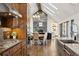 Bright open floor plan with seamless flow from kitchen to dining and living areas, featuring a cozy fireplace at 9703 Phillips Rd, Lafayette, CO 80026