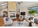 Cozy living room features a stone fireplace, hardwood floors, and elegant seating, creating a warm atmosphere at 9703 Phillips Rd, Lafayette, CO 80026
