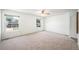 Spacious bedroom with two windows that provide plenty of natural light and neutral carpeting at 15892 E Arkansas Pl, Aurora, CO 80017
