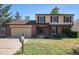 Charming two-story home with a brick facade, attached two-car garage, and well-maintained front yard at 15892 E Arkansas Pl, Aurora, CO 80017