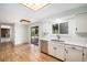 Clean, well lit, eat in kitchen with stainless dishwasher, sink and ample storage space at 15892 E Arkansas Pl, Aurora, CO 80017