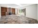 Cozy living room with fireplace, built in bookshelves, and beautiful tile floors at 15892 E Arkansas Pl, Aurora, CO 80017