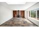 Cozy living room with fireplace, built in bookshelves, and beautiful tile floors at 15892 E Arkansas Pl, Aurora, CO 80017