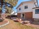 Landscaped backyard with a flagstone patio, perfect for outdoor gatherings and relaxation at 2165 S Flower St, Lakewood, CO 80227