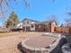 Expansive backyard with a brick and siding house and mature tree for relaxing outdoor living at 2165 S Flower St, Lakewood, CO 80227