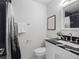 Bathroom with black accented shower, tiled floor, and modern vanity with sink at 2165 S Flower St, Lakewood, CO 80227