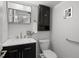 Stylish bathroom features a dark vanity, marble countertop, and modern fixtures at 2165 S Flower St, Lakewood, CO 80227