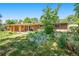 Backyard of brick ranch style home with patio and lush garden at 6780 Allison St, Arvada, CO 80004