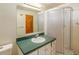Bathroom featuring a single sink, vanity, shower, and toilet at 6780 Allison St, Arvada, CO 80004