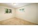 Simple bedroom with carpet and two windows at 6780 Allison St, Arvada, CO 80004