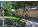Home featuring manicured lawn and mature tree, offering shade and curb appeal at 6780 Allison St, Arvada, CO 80004