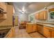 Open kitchen with granite countertops, stainless steel appliances, and dining area at 6780 Allison St, Arvada, CO 80004