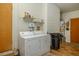 Laundry room with washer, dryer and shelving at 6780 Allison St, Arvada, CO 80004