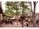 Vibrant outdoor dining scene with string lights and hanging flower baskets at 6780 Allison St, Arvada, CO 80004