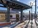 Train station with benches under a modern metal awning at 6780 Allison St, Arvada, CO 80004