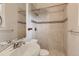 Bathroom featuring tiled shower with glass door and modern sink at 1839 Grove St, Denver, CO 80204