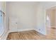 Bedroom with hardwood floors and a built-in closet, showing natural light from window at 1839 Grove St, Denver, CO 80204