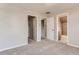 Well-lit bedroom with carpet, and access to closets and bath at 1839 Grove St, Denver, CO 80204