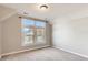 Spacious bedroom with large window and neutral carpeting at 1839 Grove St, Denver, CO 80204