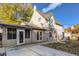 House exterior showcases a large backyard and screened porch at 1839 Grove St, Denver, CO 80204