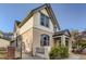 Charming two-story home with a brick fence and landscaped yard at 1839 Grove St, Denver, CO 80204