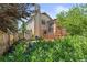 A lush backyard features a small deck and native foliage and grasses at 19937 E Loyola Pl, Aurora, CO 80013