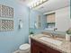 Stylish bathroom features a granite countertop, under-cabinet storage and modern decor at 19937 E Loyola Pl, Aurora, CO 80013