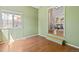 Bedroom with wood floors and an open doorway at 19937 E Loyola Pl, Aurora, CO 80013