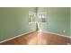 This cozy bedroom offers natural light from the corner windows and neutral decor at 19937 E Loyola Pl, Aurora, CO 80013